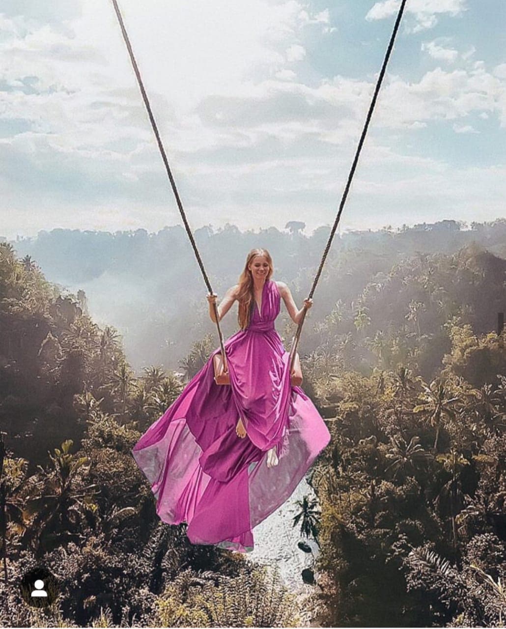Guest on the single swing over the valley at Aloha Ubud Swing Tegallalang