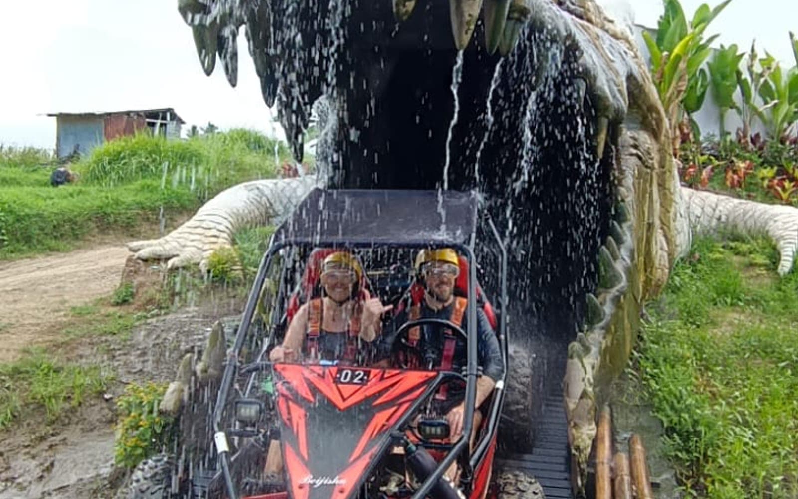 UTV buggy driving through the crocodile water-gate on the track